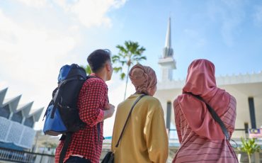 group-of-asian-muslim-tourists-enjoying-the-view-of-city-mosque-picture-id1265026190