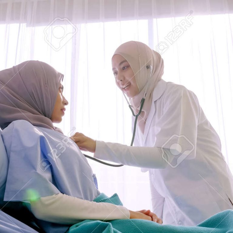 141512947-muslim-female-doctor-checking-up-patient-s-health-at-hospital-room