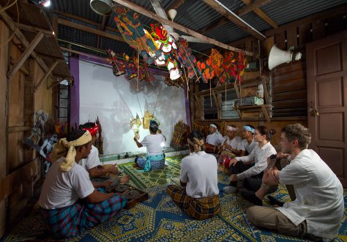 A group of men engage in Wayang Kulit performances in Kelantan